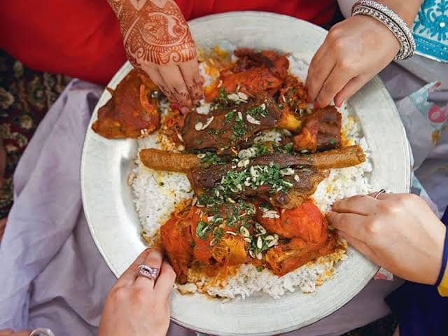 tourists enjoying local kashmir cuisine