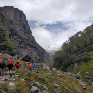 trekkers are climbing the mountains at hampta pass trek