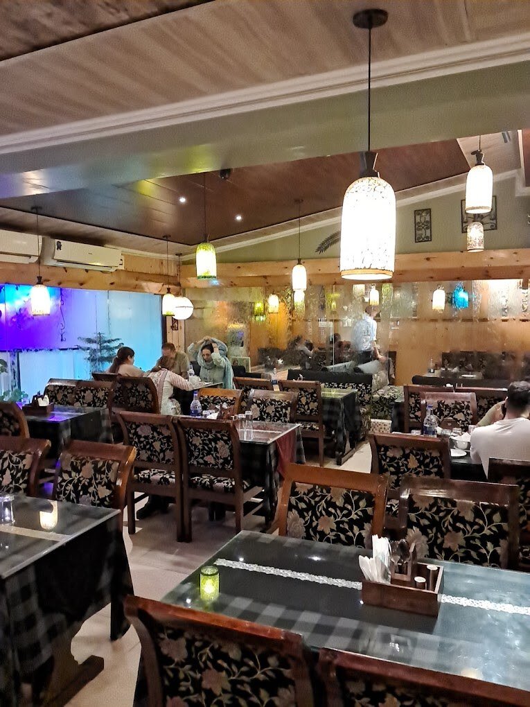 Streams Restaurant offers a warm, cozy ambiance with elegant décor in srinagar