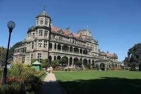 Indian Institute of Advanced Study building with stone architecture and a large green lawn