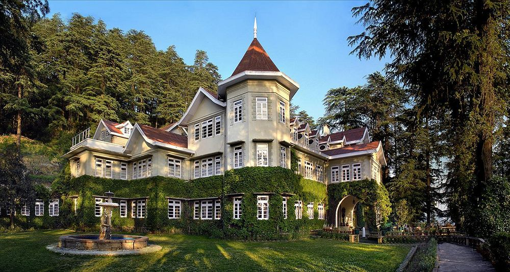 Rothney Castle surrounded by trees and greenery in Shimla
