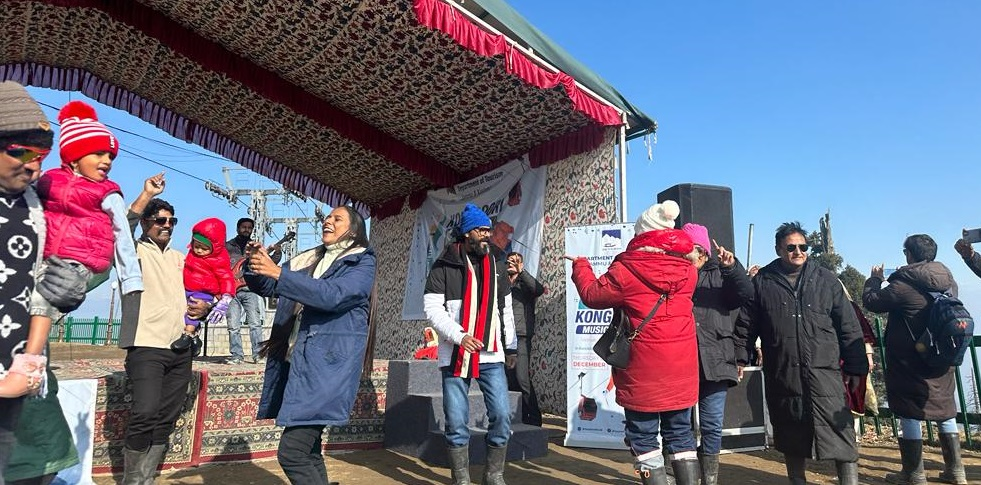 Tourists enjoying local music and dance at Gulmarg cultural event
