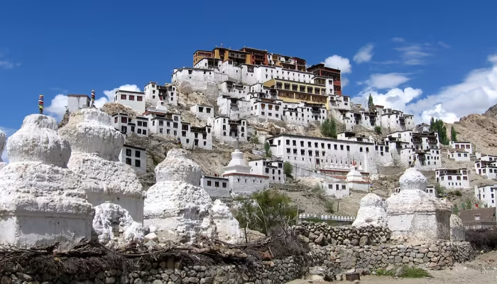 Alchi Monastery with white stupas and traditional Tibetan architecture on a hillside
